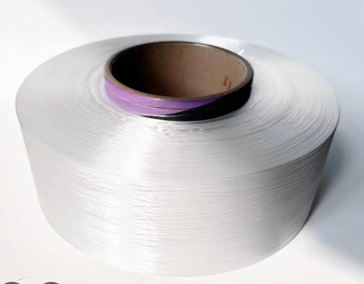A large white yarn package representing textile and factory supply work.